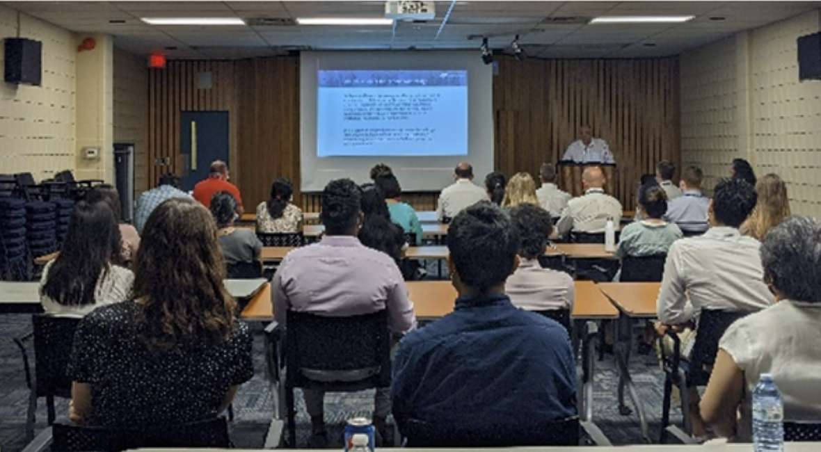 Photograph of group of people during Bob Watts' indigenous day presentation